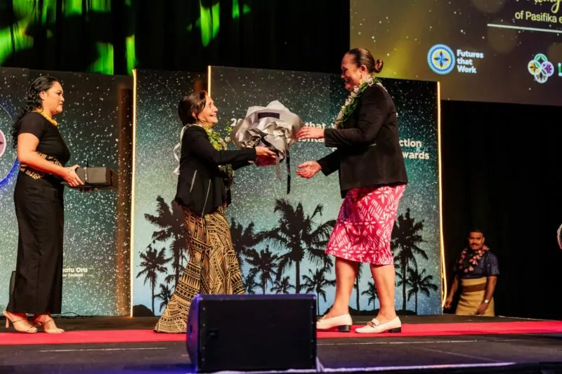 Denise Kingi 'Ulu'ave presenting flowers to Hon Carmel Sepuloni