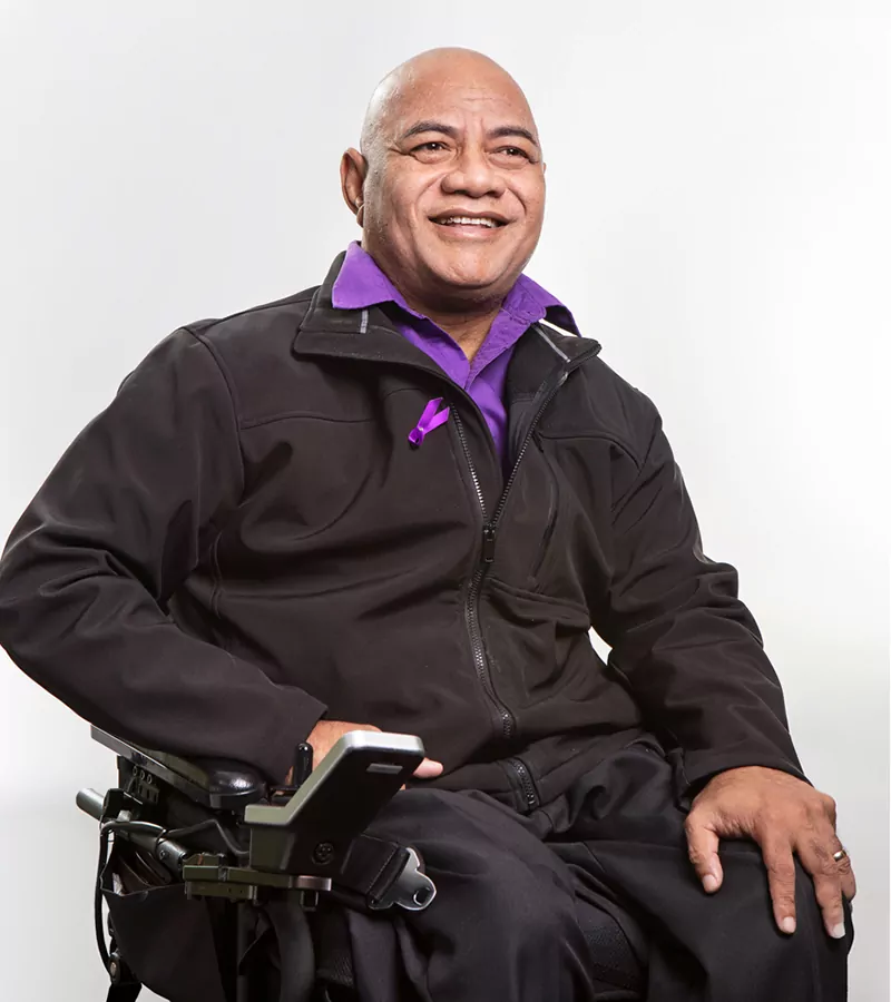 lolomanaia filiiai smiling in a wheelchair