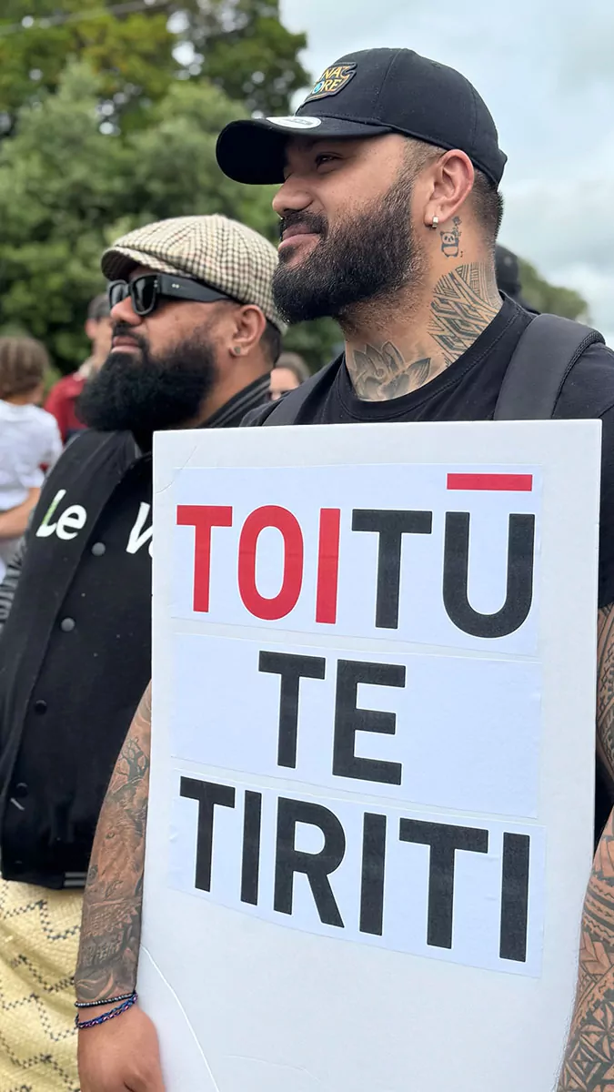 Ben Tameifuna and Charles Lavea holding a Toitu te Tiriti sign