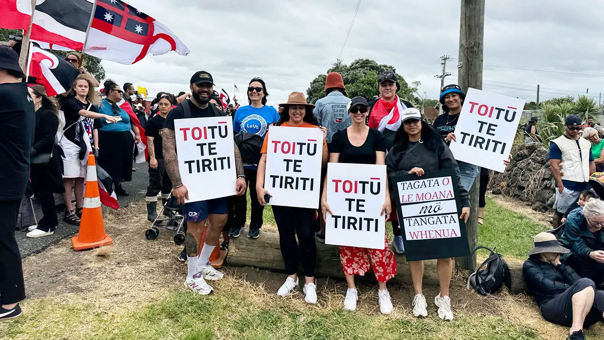 The Le Va team at the hikoi mo te Tiriti holding signs
