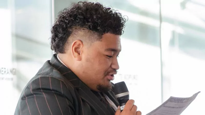 Young man speaking into a microphone